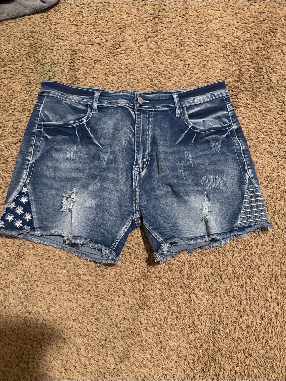 Distressed Blue Denim Women’s Shorts with Flag Accent